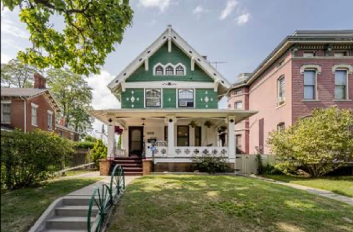 Front exterior of The Emerald Lady, a pink and green Victorian home in Toledo